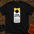 Pooch On Break - T-Shirt in Black - A graphic shaped like a door hanger featuring a yellow bone design at the top. The...