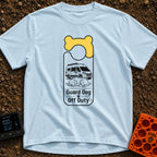 Pooch On Break - T-Shirt in Chambray - A graphic shaped like a door hanger featuring a yellow bone design at the top. The...
