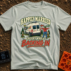Happily Hitched Campers - T-Shirt in Bay - A cartoon illustration of a campervan backing into a wooded campsite between...