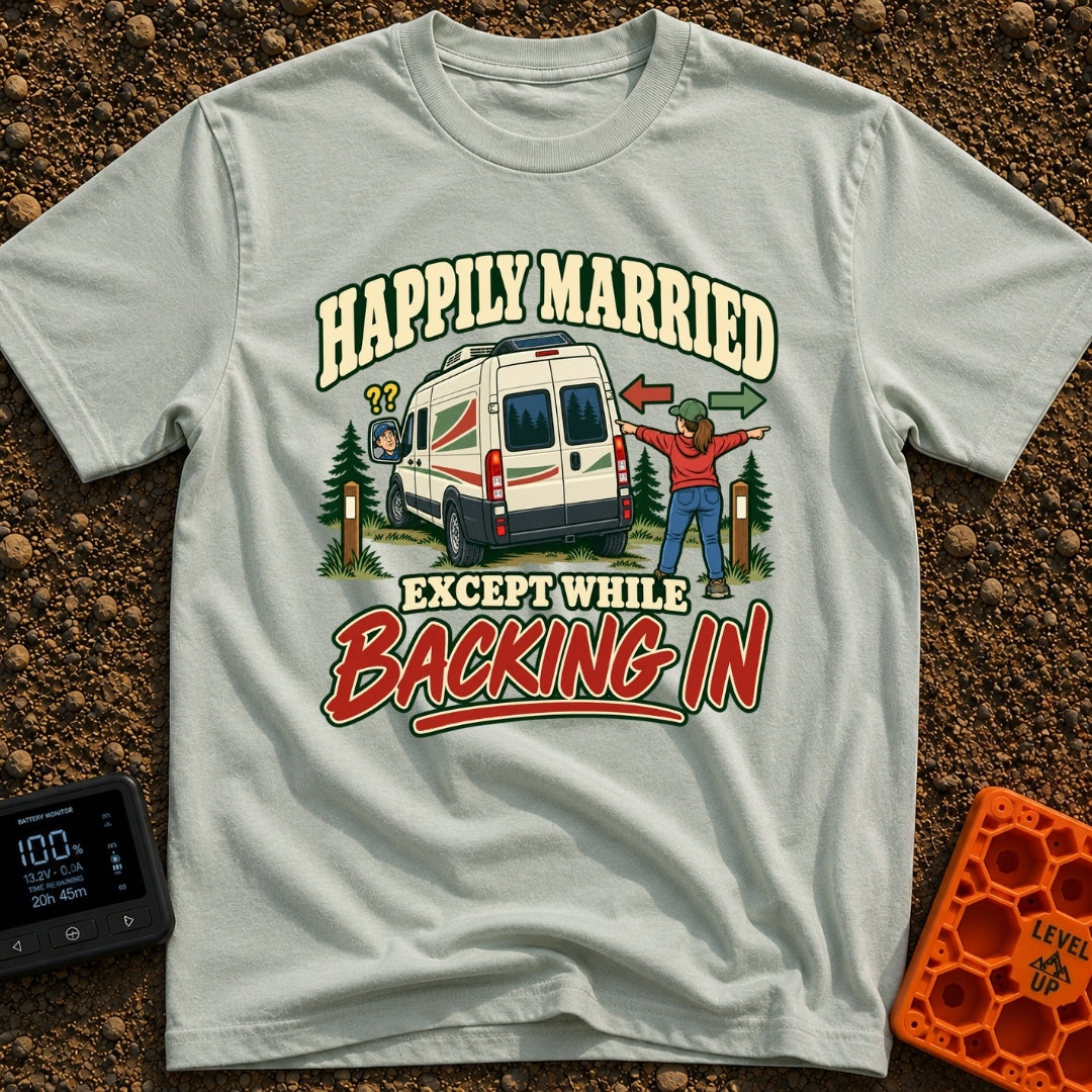 Happily Hitched Campers - T-Shirt in Bay - A cartoon illustration of a campervan backing into a wooded campsite between...