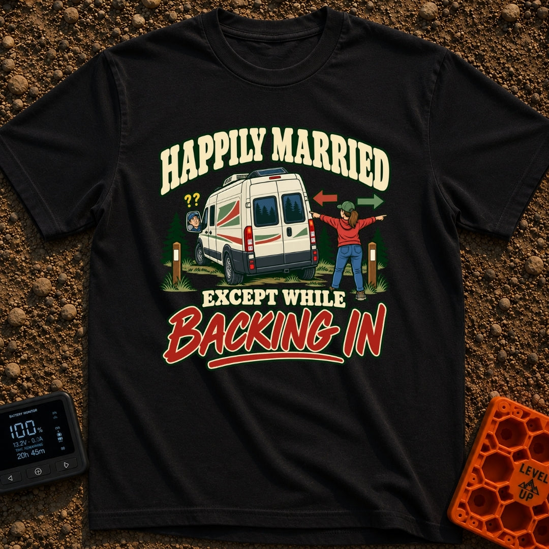 Happily Hitched Campers - T-Shirt in Black - A cartoon illustration of a campervan backing into a wooded campsite between...