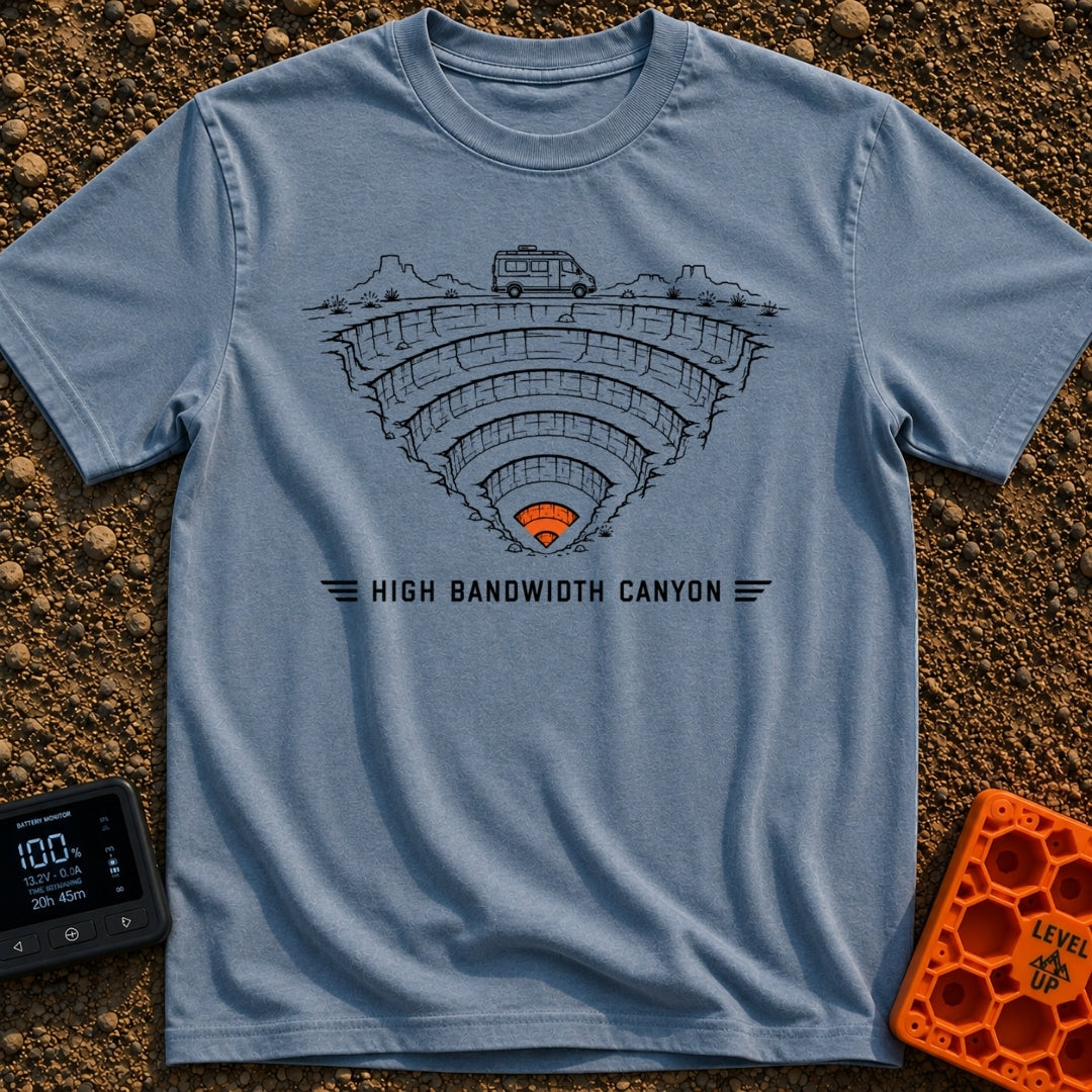 Canyon Wide Web - T-Shirt in Blue Jean - A black-and-white line drawing of a camper van parked on the rim of a deep,...