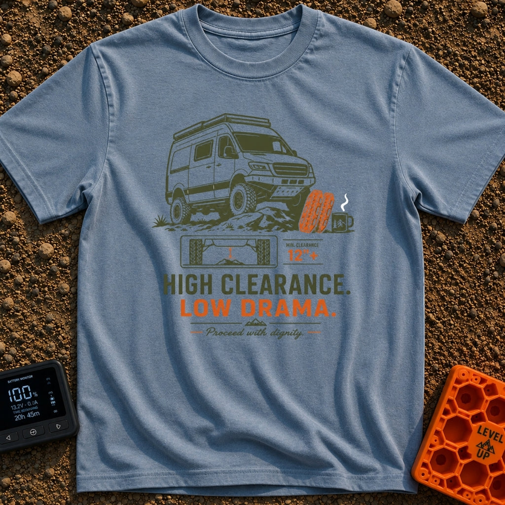 High Clearance Low Drama - T-Shirt in Blue Jean - A lifted camper van is shown driving over rocks next to two orange...