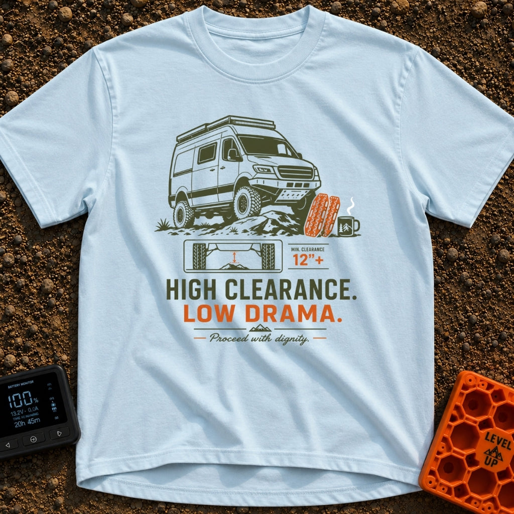 High Clearance Low Drama - T-Shirt in Chambray - A lifted camper van is shown driving over rocks next to two orange...