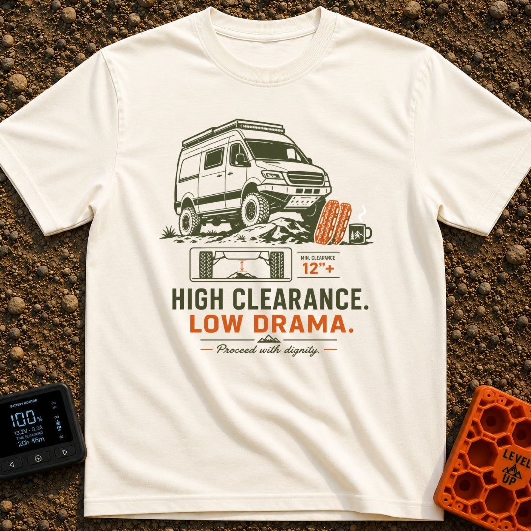 High Clearance Low Drama - T-Shirt in Ivory - A lifted camper van is shown driving over rocks next to two orange vehicle...