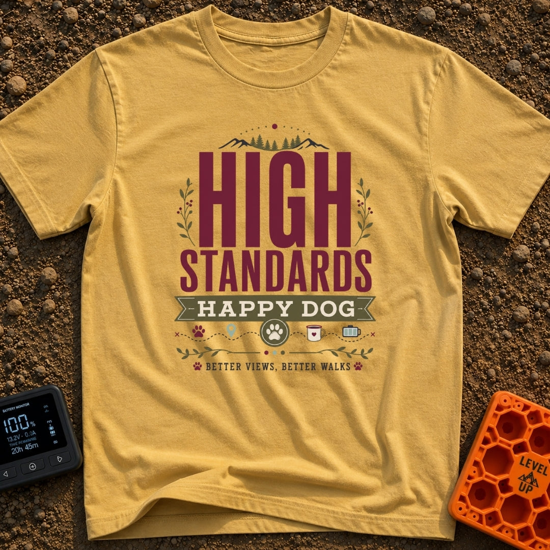 High Standards Happy Dog - T-Shirt in Mustard - A typographic design featuring the text "HIGH STANDARDS HAPPY DOG" and...