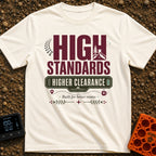 Elevated Adventure Standards - T-Shirt in Ivory - A typographic design featuring the text "HIGH STANDARDS HIGHER...