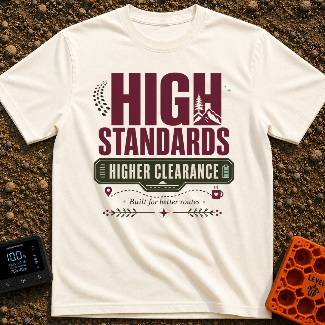 Elevated Adventure Standards - T-Shirt in Ivory - A typographic design featuring the text "HIGH STANDARDS HIGHER...