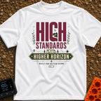 High Standards Higher Horizon - T-Shirt in White - The artwork features the text "HIGH STANDARDS" with a mountain and...