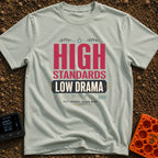 High Standards Low Drama - T-Shirt in Bay - Typographic design reading "HIGH STANDARDS LOW DRAMA" and "FULL CHARGE, CLEAR...