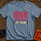High Standards Low Drama - T-Shirt in Blue Jean - Typographic design reading "HIGH STANDARDS LOW DRAMA" and "FULL CHARGE,...