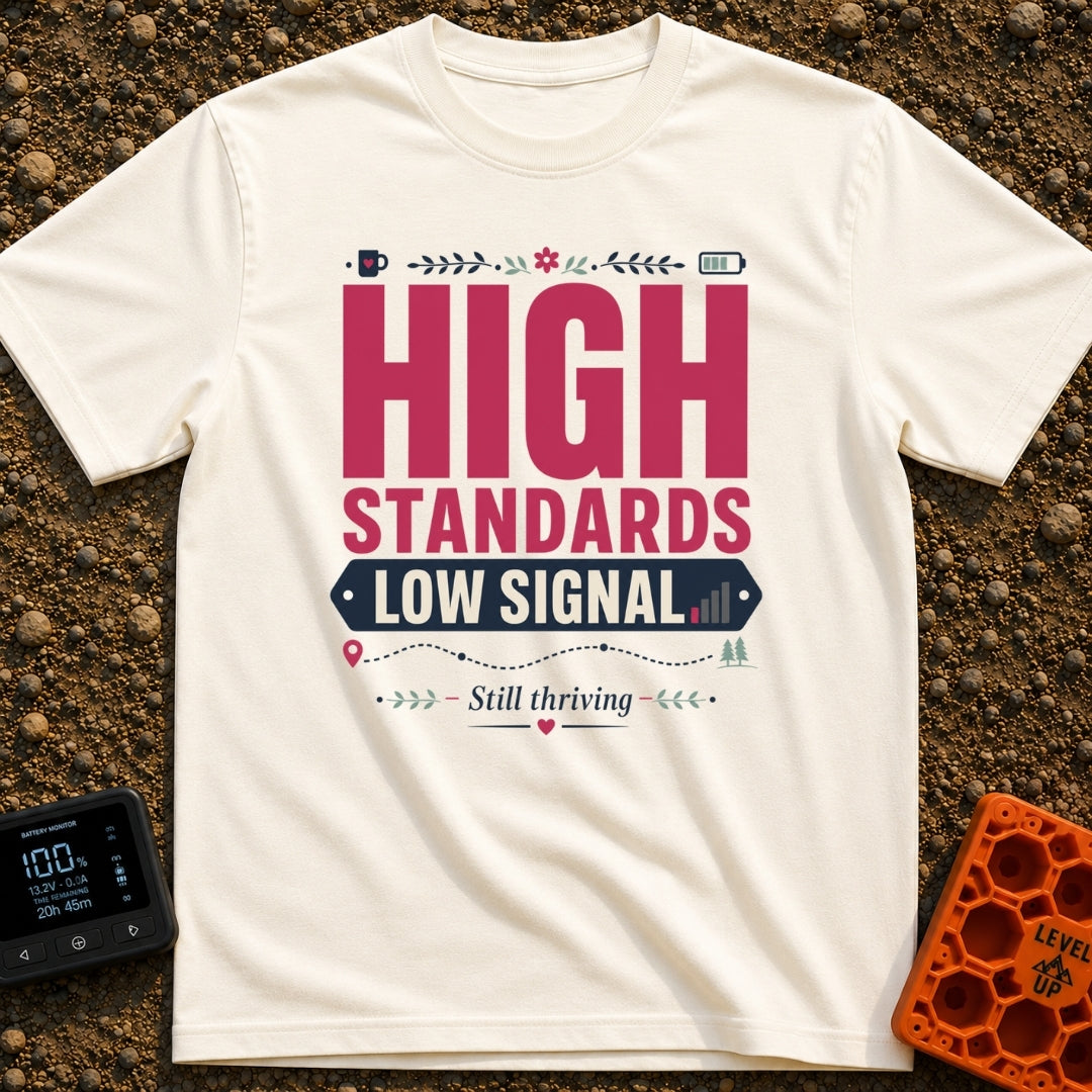Standards And Signals - T-Shirt in Ivory - A typographic design reading "HIGH STANDARDS LOW SIGNAL" and "Still thriving",...