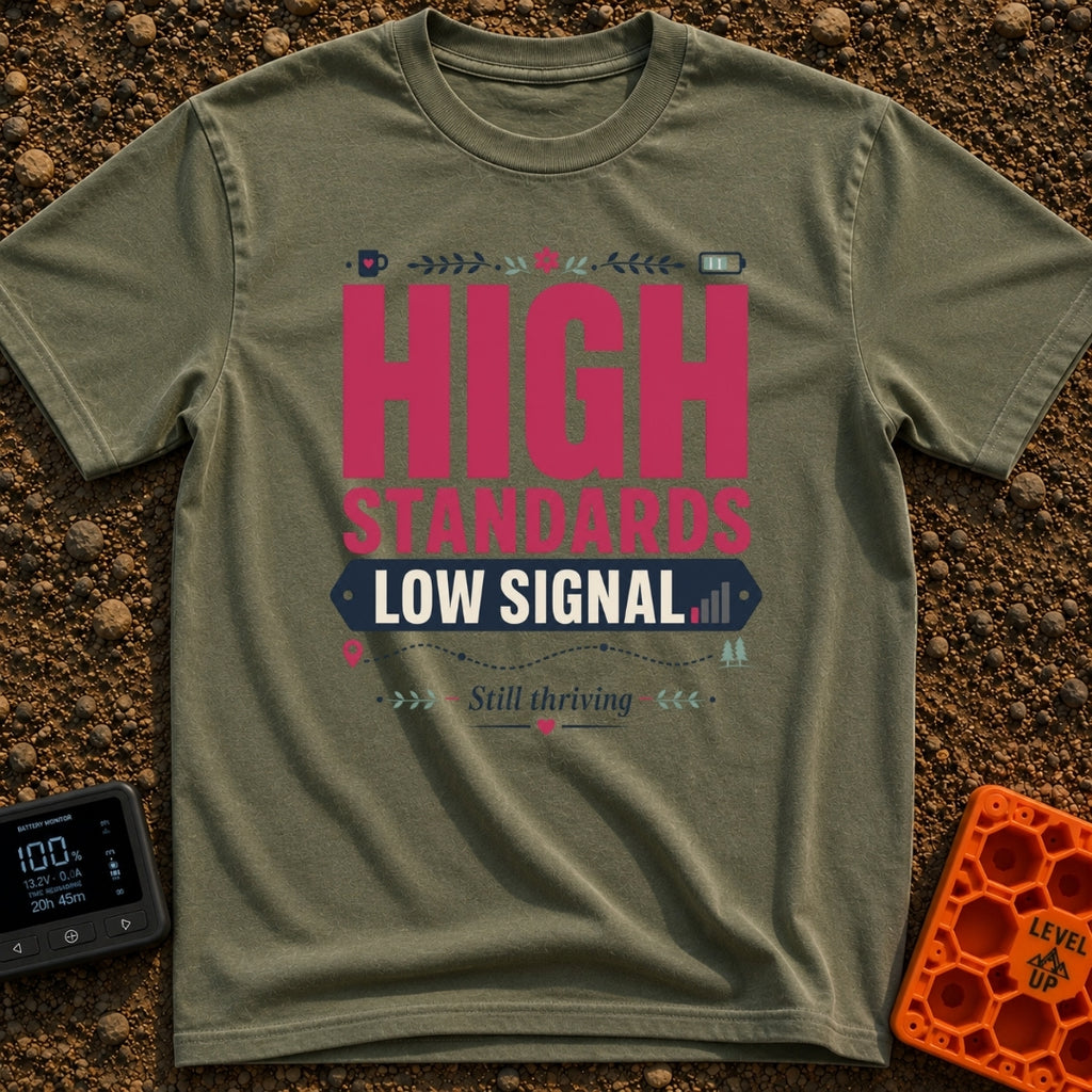 Standards And Signals - T-Shirt in Moss - A typographic design reading "HIGH STANDARDS LOW SIGNAL" and "Still thriving",...