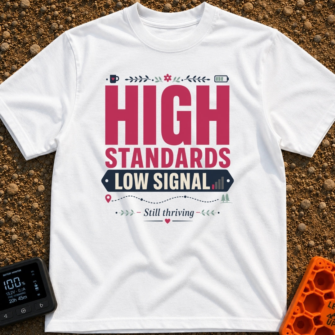 Standards And Signals - T-Shirt in White - A typographic design reading "HIGH STANDARDS LOW SIGNAL" and "Still thriving",...