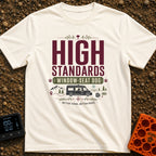 Pawsome Van View - T-Shirt in Ivory - A typographic design reading "HIGH STANDARDS WINDOW-SEAT DOG" above an illustration...