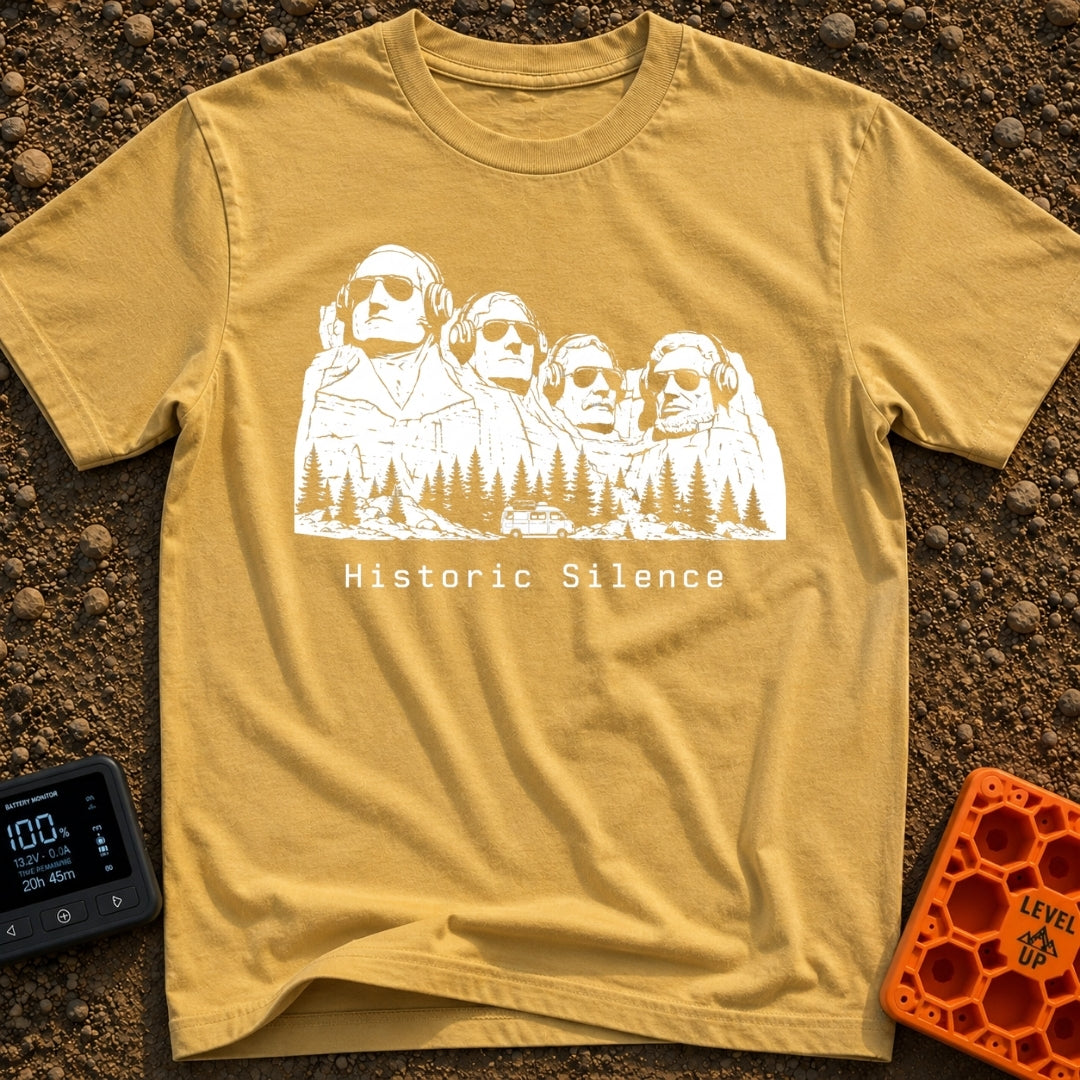 Sound of Historic Silence - T-Shirt in Mustard - A black and white illustration of the Mount Rushmore presidents wearing...