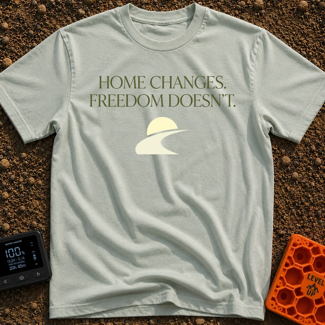 Home Moves Freedom Stays - T-Shirt in Bay - Text reading "HOME CHANGES. FREEDOM DOESN'T." in olive green serif font above...