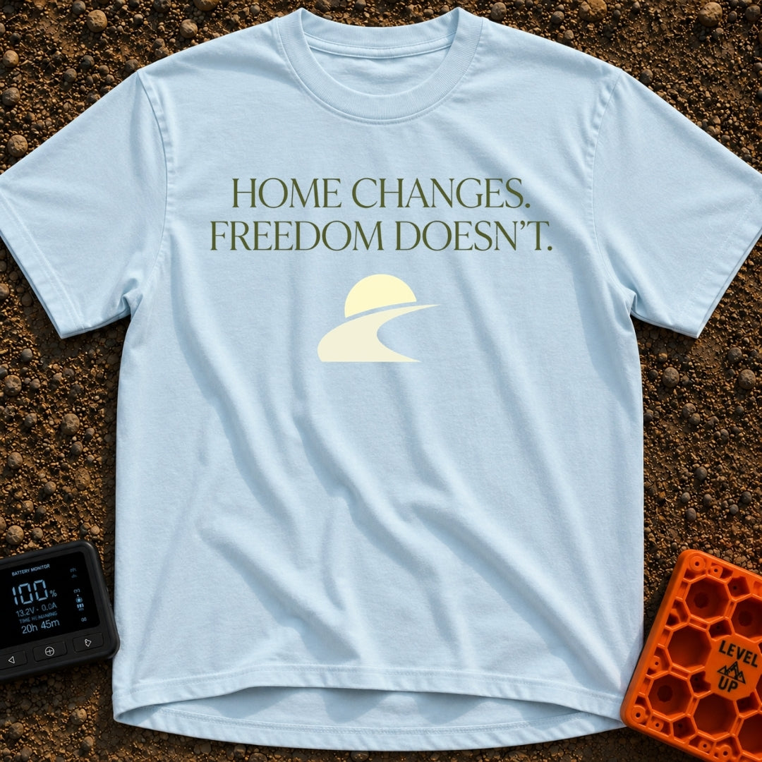 Home Moves Freedom Stays - T-Shirt in Chambray - Text reading "HOME CHANGES. FREEDOM DOESN'T." in olive green serif font...