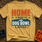 Where Dog Bowl Lands - T-Shirt in Mustard - Typographic design reading "HOME IS WHERE THE DOG BOWL LANDS" featuring...