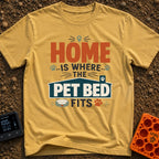 Where The Pet Fits - T-Shirt in Mustard - A typographic design reading "HOME IS WHERE THE PET BED FITS" featuring paw...