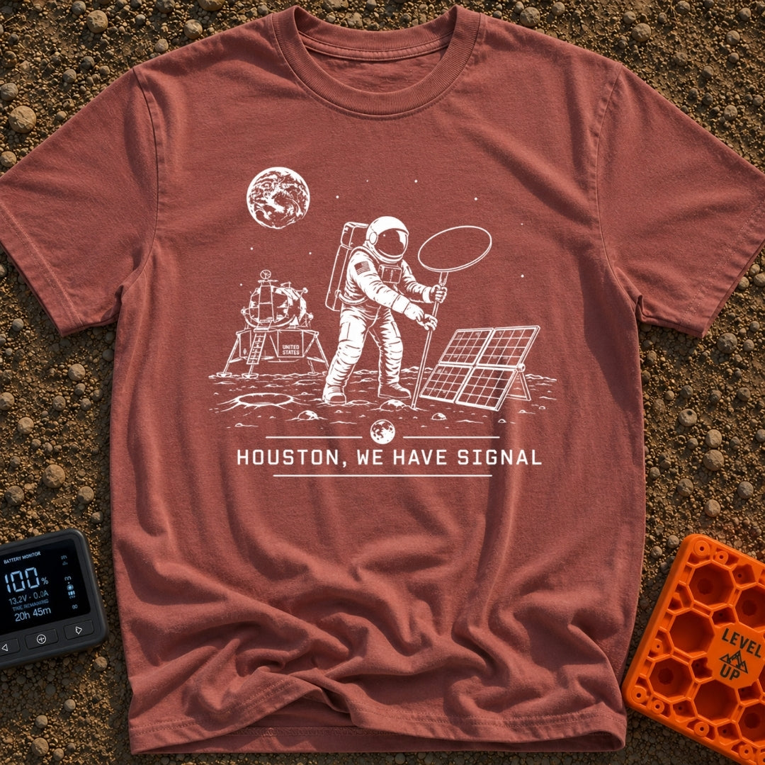 Houston We Have Bars - T-Shirt in Brick - A black and white line-art illustration of an astronaut on the moon holding up...
