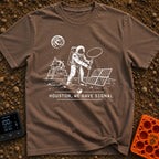 Houston We Have Bars - T-Shirt in Espresso - A black and white line-art illustration of an astronaut on the moon holding...