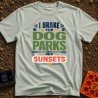 Chasing Sunsets And Tails - T-Shirt in Bay - A typographical design reading "I BRAKE FOR DOG PARKS AND SUNSETS" featuring...