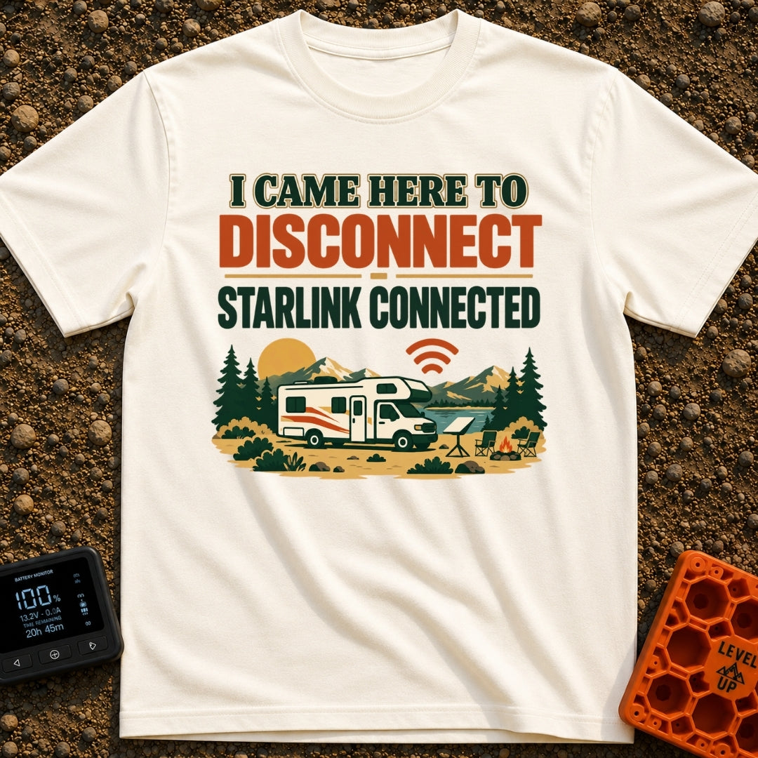 Disconnect My Starlink - T-Shirt in Ivory - A Class C motorhome parked near a lake and mountains, featuring a campsite...