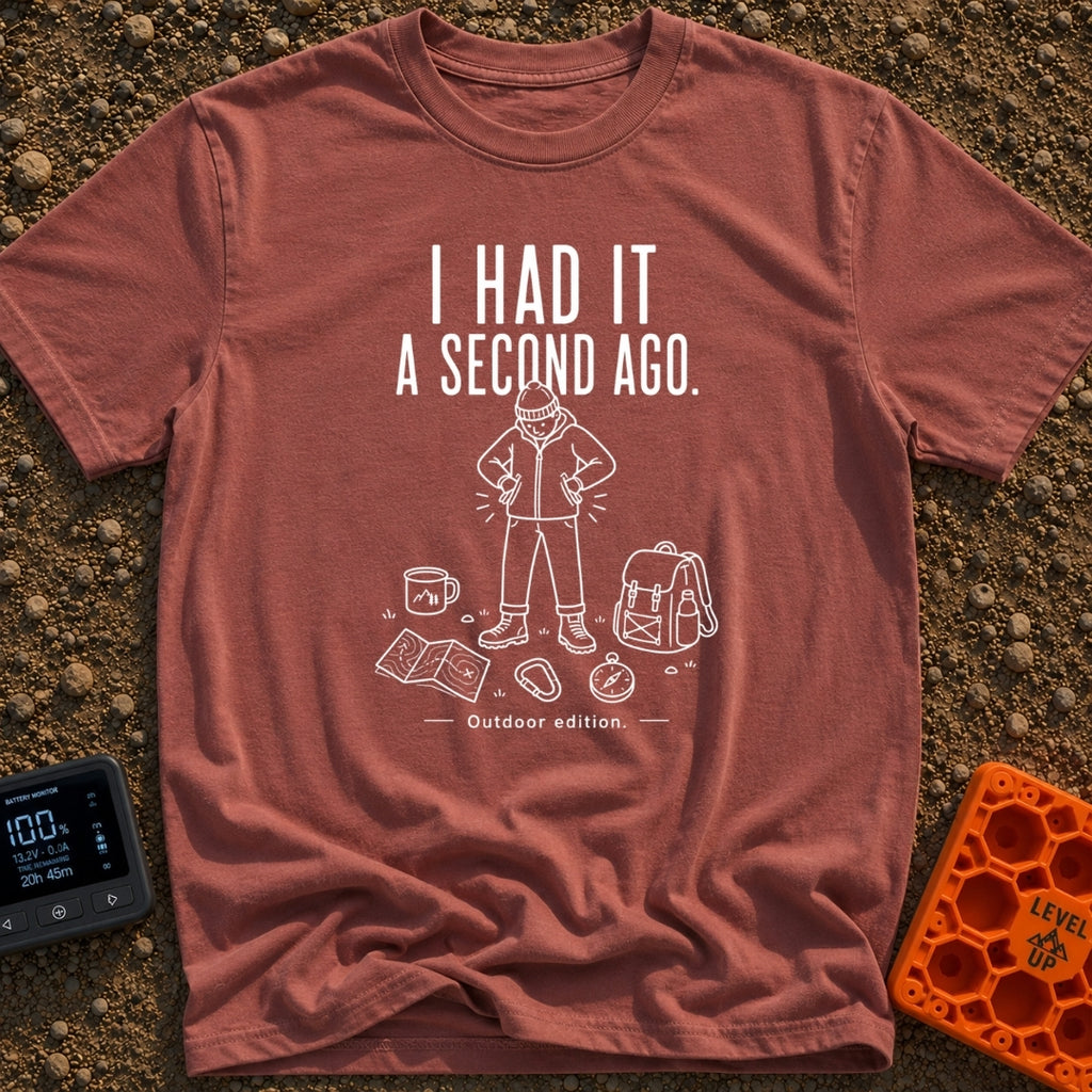 It Was Just Here - T-Shirt in Brick - A white line drawing of a person in a beanie and jacket looking down and searching...