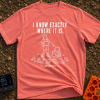I Know It's Here - T-Shirt in Watermelon - A white line drawing of a person in a cap and shorts pointing at an open...