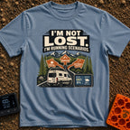 I Am Running Scenarios - T-Shirt in Blue Jean - A white camper van drives toward three directional signs reading...