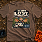 I Am Running Scenarios - T-Shirt in Espresso - A white camper van drives toward three directional signs reading 'Coffee',...