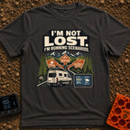 I Am Running Scenarios - T-Shirt in Graphite - A white camper van drives toward three directional signs reading 'Coffee',...