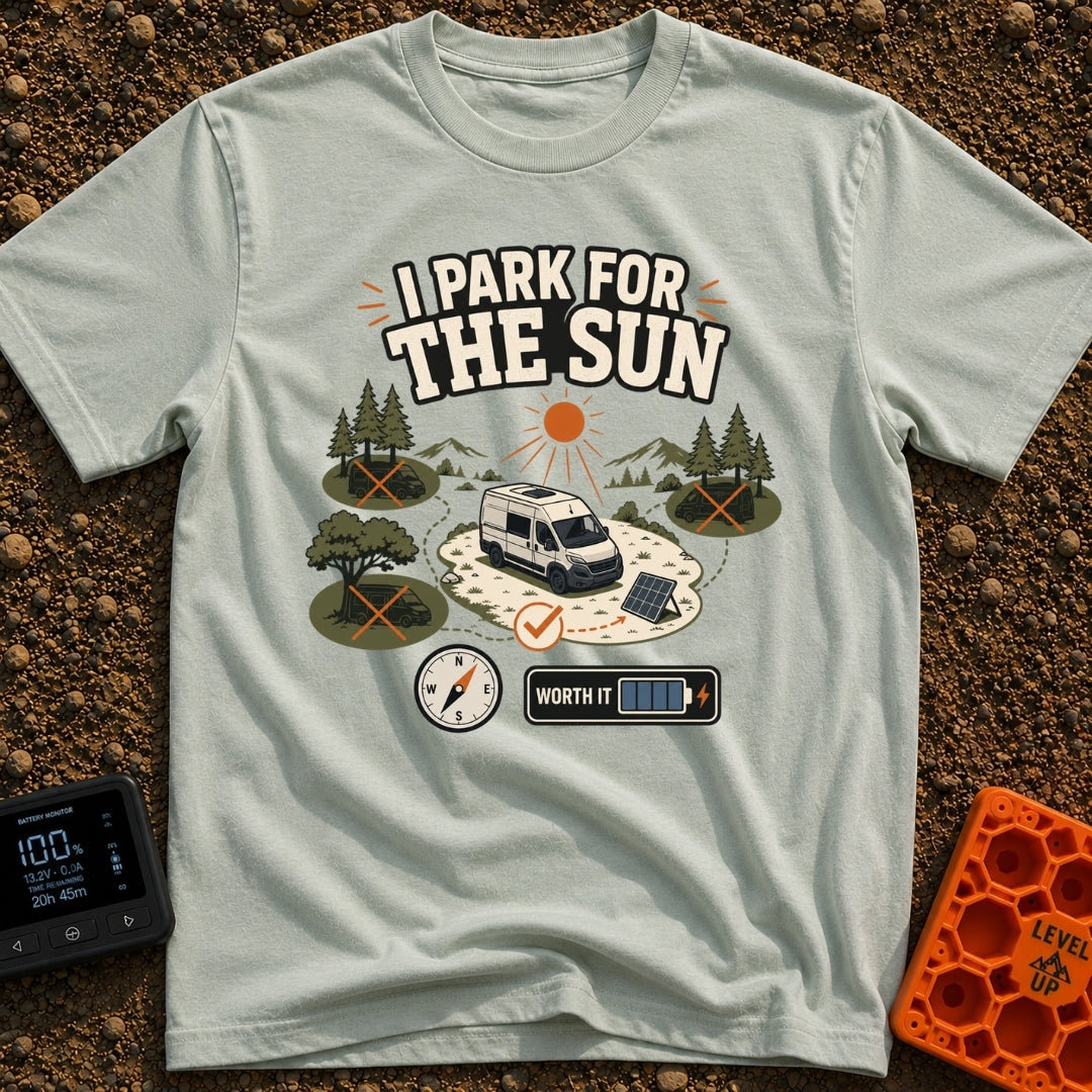 Chase The Sun - T-Shirt in Bay - A white camper van parked in a sunny clearing with a portable solar panel set up,...