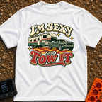 Sexy And I Tow - T-Shirt in White - A retro-style illustration of a green pickup truck towing a large fifth-wheel camper...
