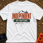 Independent By Nature - T-Shirt in White - A graphic design featuring mountain peaks, pine trees, and topographical map...