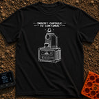 Insert Pod To Continue - T-Shirt in Black - A black and white illustration of a pod-style coffee maker sitting on top of...