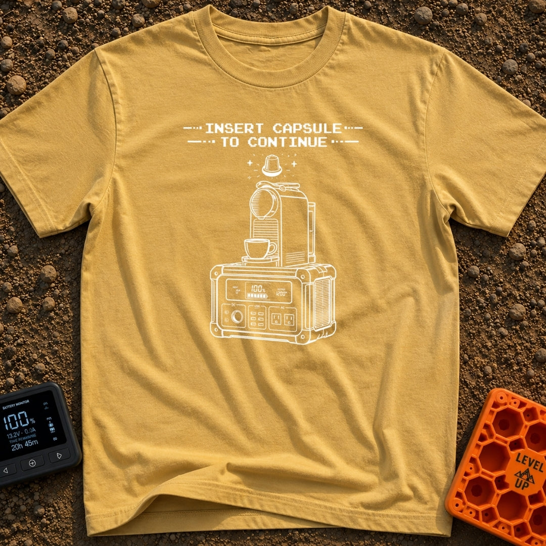 Insert Pod To Continue - T-Shirt in Mustard - A black and white illustration of a pod-style coffee maker sitting on top...