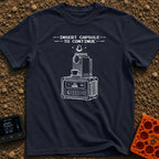 Insert Pod To Continue - T-Shirt in Navy - A black and white illustration of a pod-style coffee maker sitting on top of a...