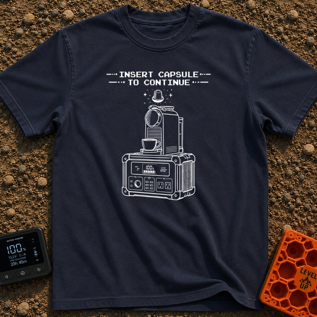 Insert Pod To Continue - T-Shirt in Navy - A black and white illustration of a pod-style coffee maker sitting on top of a...
