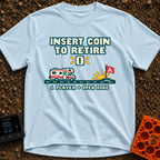 Insert Coin To Retire - T-Shirt in Chambray - A retro 8-bit pixel art design showing a Class C RV driving on a dashed...