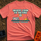 Insert Coin To Retire - T-Shirt in Watermelon - A retro 8-bit pixel art design showing a Class C RV driving on a dashed...