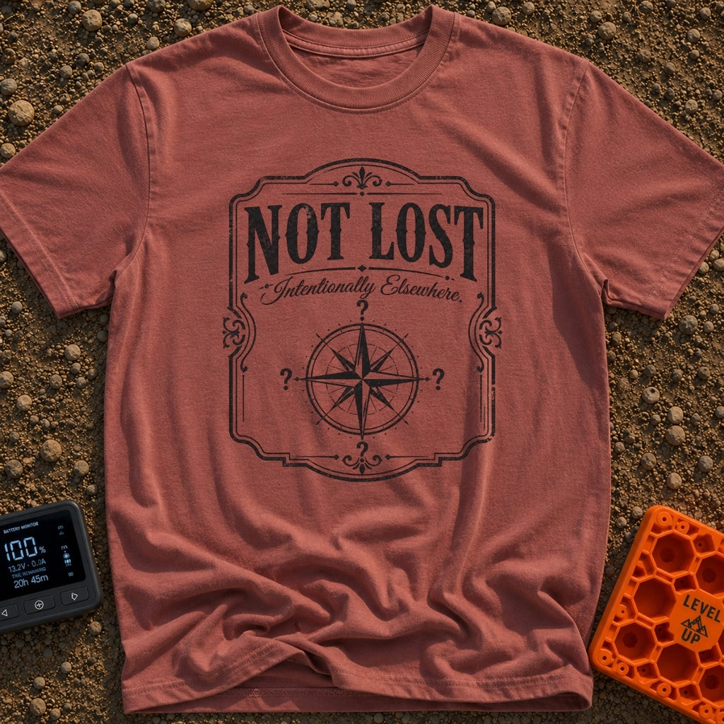 Elsewhere On Purpose - T-Shirt in Brick - A black and white distressed graphic featuring an ornate border, with bold text...