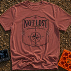 Elsewhere On Purpose - T-Shirt in Brick - A black and white distressed graphic featuring an ornate border, with bold text...
