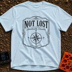 Elsewhere On Purpose - T-Shirt in Chambray - A black and white distressed graphic featuring an ornate border, with bold...