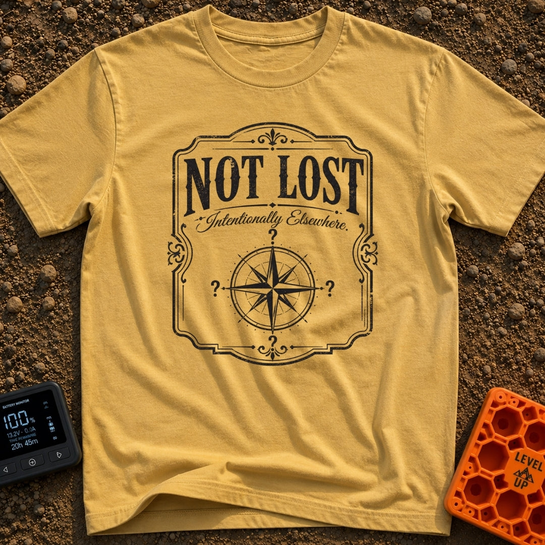 Elsewhere On Purpose - T-Shirt in Mustard - A black and white distressed graphic featuring an ornate border, with bold...