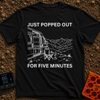 Out For Five Minutes - T-Shirt in Black - A black and white line drawing of a camper van with its side door open, parked...