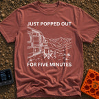 Out For Five Minutes - T-Shirt in Brick - A black and white line drawing of a camper van with its side door open, parked...