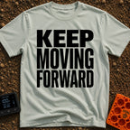 Put It In Drive - T-Shirt in Bay - Large, bold black text stacked in three lines reading "KEEP MOVING FORWARD" with no...