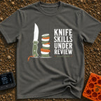 Chop Till You Drop - T-Shirt in Pepper - An illustration of a green-handled outdoor knife with an orange lanyard standing...